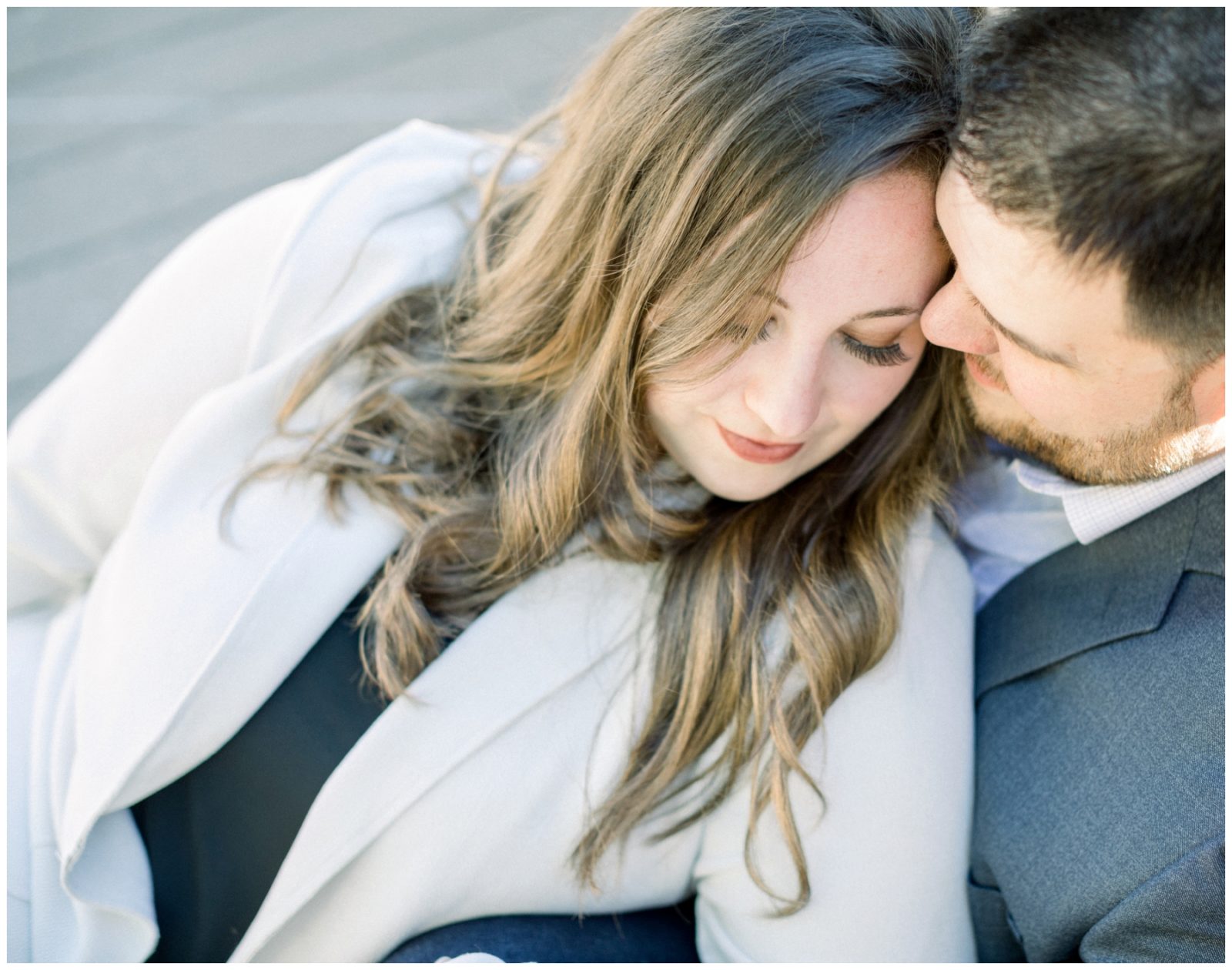 Minneapolis Engagement Session shot by Poly Mendes Photography. Couple leaning into each other. 